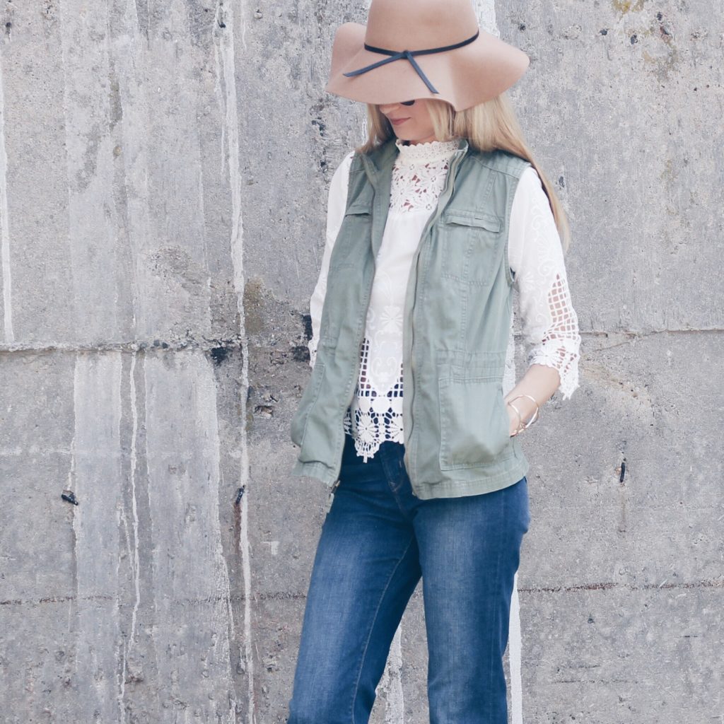 $20 high neck embroidered white top with utility vest and flare jeans