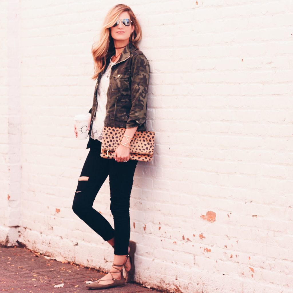 fall casual - camo jacket, black distressed skinny jeans, leopard clutch