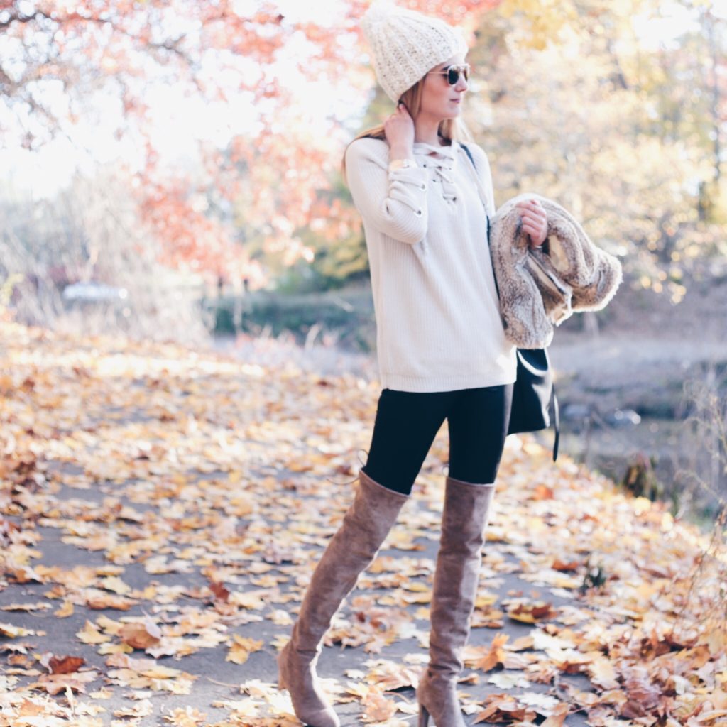 Connecticut life and style blogger, Pinteresting Plans shares a holiday out complete with lace-up sweater, fur vest, and over the knee boots.