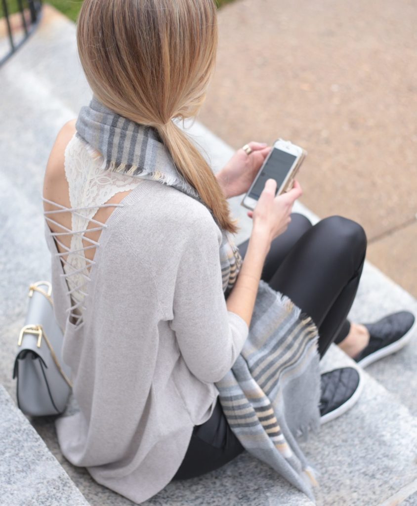 slouchy off the shoulder sweater over lace bralette with leather leggings