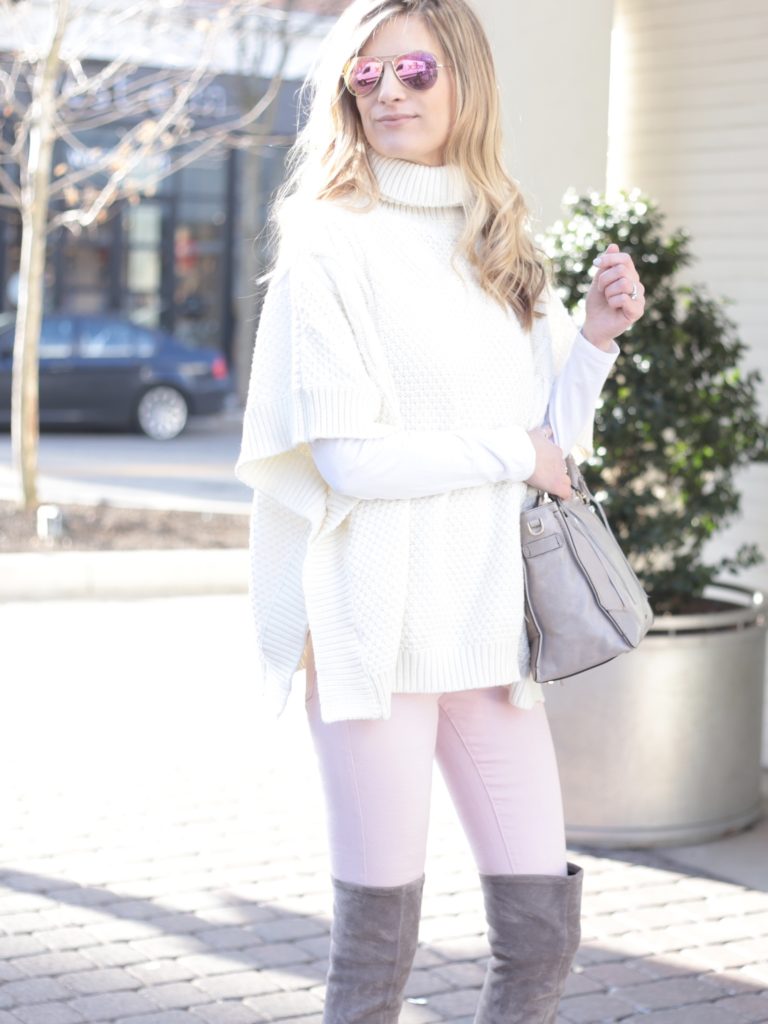 white sweater poncho with pink skinny jeans