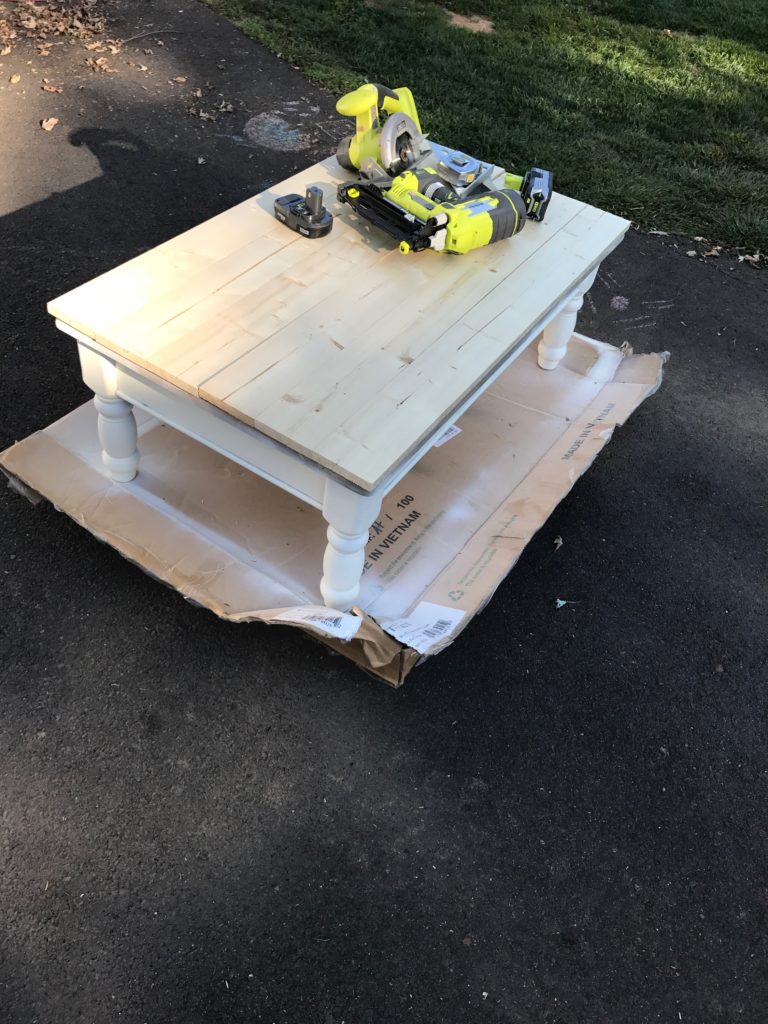 farmhouse coffee table - wood planks nailed to the top of the coffee table