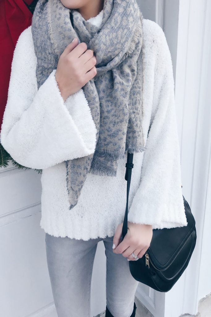  holiday outfits with leggings - cozy sweater over denim leggings and knee high boots on pinterestingplans