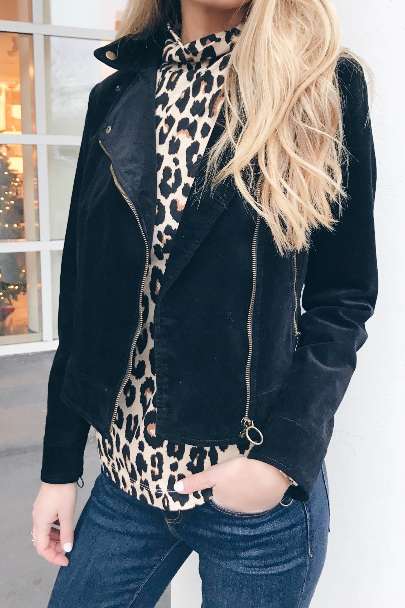  leopard turtleneck and black velvet moto jacket - leopard holiday party outfits