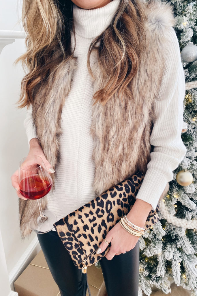 amazon white turtleneck sweater with  faux fur vest spanx black faux leather leggings and victoria emerson boho wrap bracelet