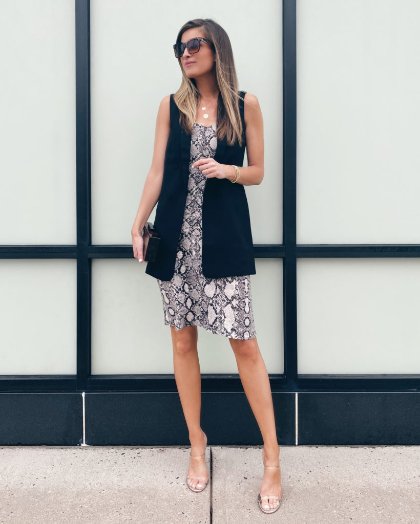 styling a snakeskin midi slip dress with a black sleeveless blazer vest