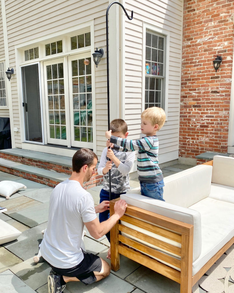 installing poles to hang patio string lights - pinteresting plans blog