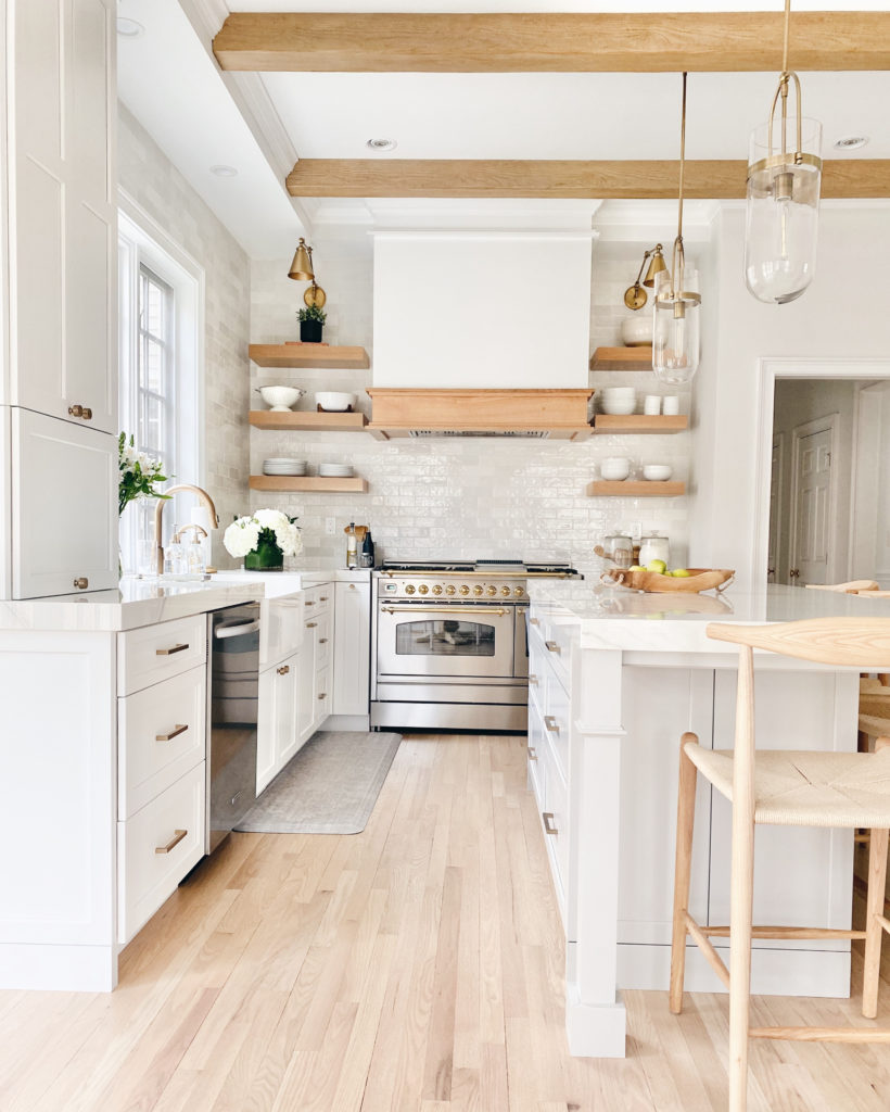 WHITE AND WOOD KITCHEN REMODEL REVEAL - Pinteresting Plans; Click here to see this kitchen remodel reveal on Pinteresting Plans! I am finally sharing the details of our kitchen remodel. We gutted our kitchen for a major kitchen remodel with island. Kitchen ideas remodeling budget small. Kitchen remodel on a budget small diy. Kitchen remodel before and after layout open concept. Modern kitchen ideas contemporary white wood. Kitchen decor ideas themes color schemes gray. Kitchen remodel ideas layout renovation. 