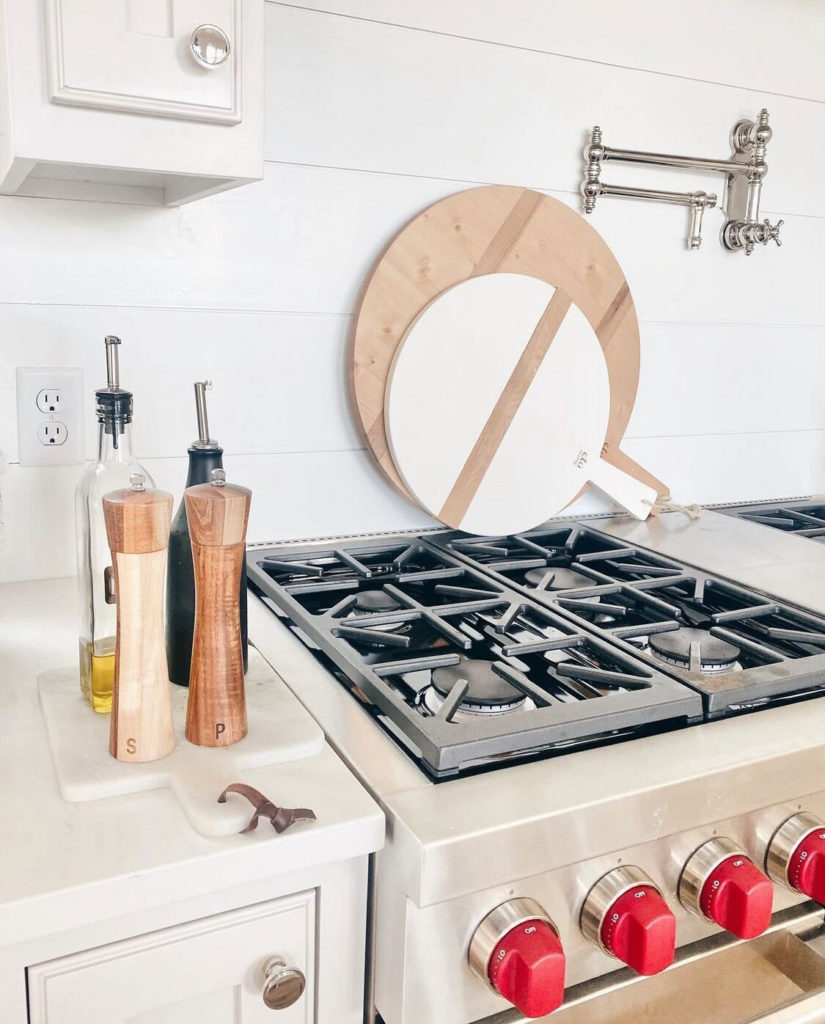 cute round charcuterie board and wooden salt pepper grinders