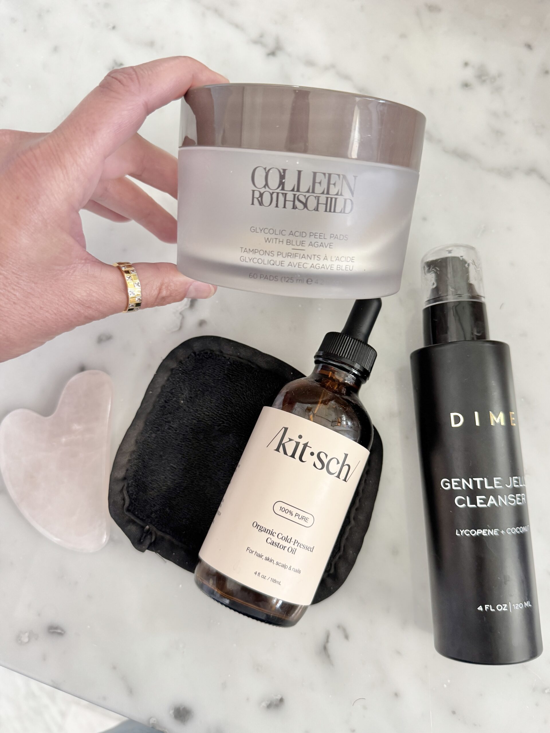 A simple skincare routine for women in their 40s featuring Colleen Rothschild Glycolic Acid Peel Pads, Kitsch Castor Oil and Dime Gentle Jelly Cleanser.